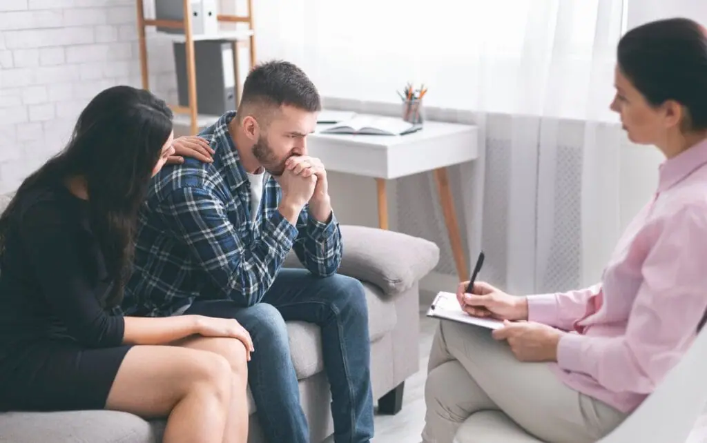 woman supporting husband after relapse