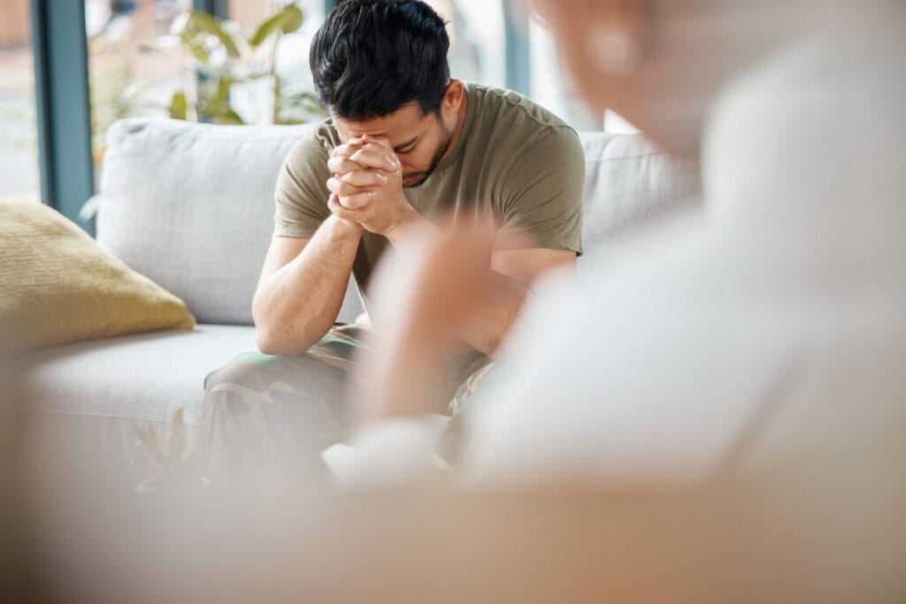 depressed man in trauma therapy