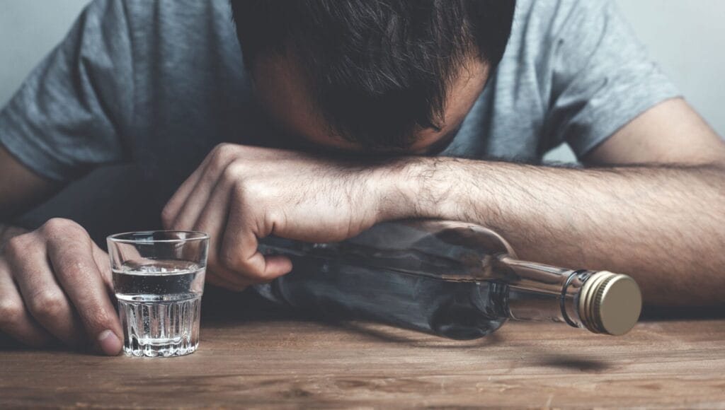 alcoholic man drinking vodka