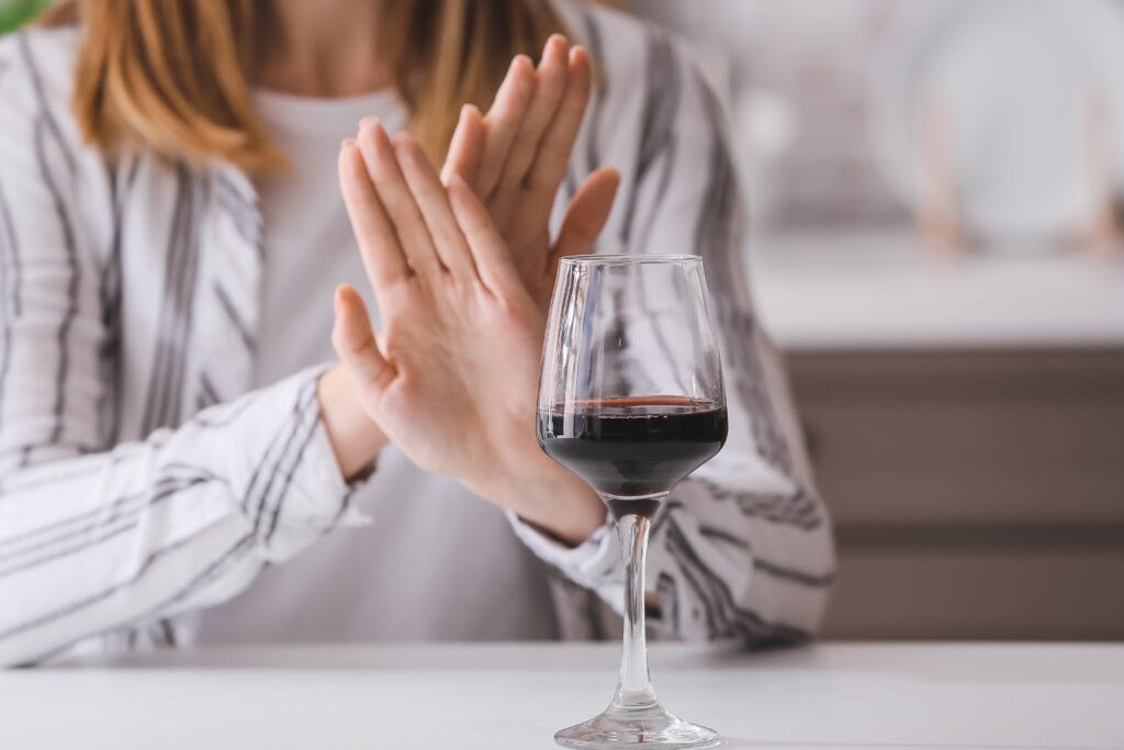 woman refusing to drink alcohol