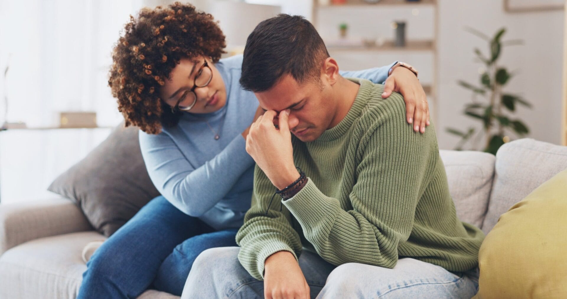 grieving man in recovery being supported