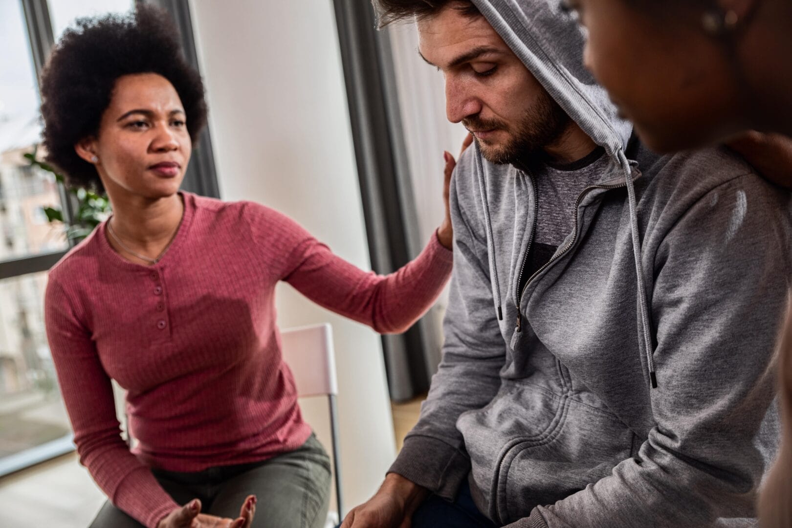 woman helping her friend with addiction