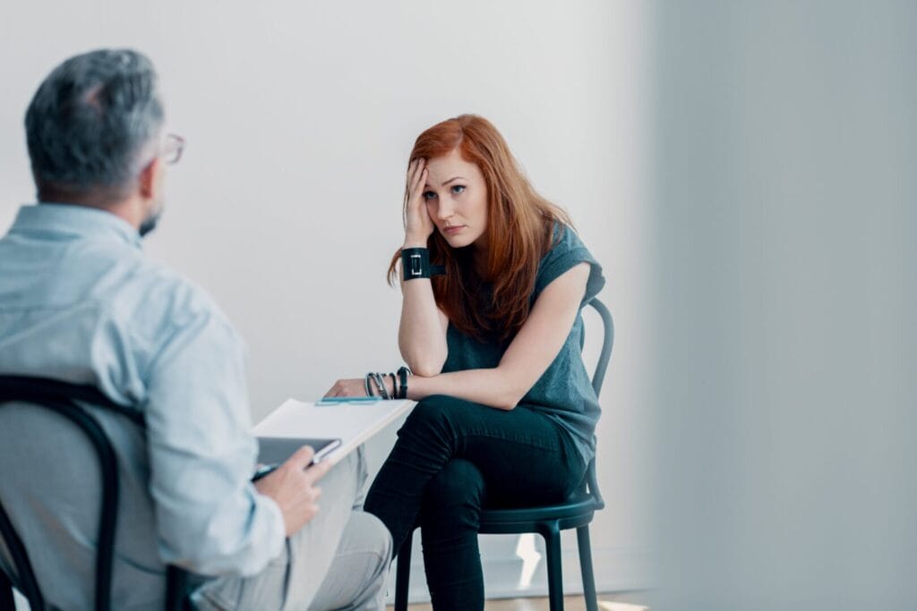 woman discussing addiction with therapist
