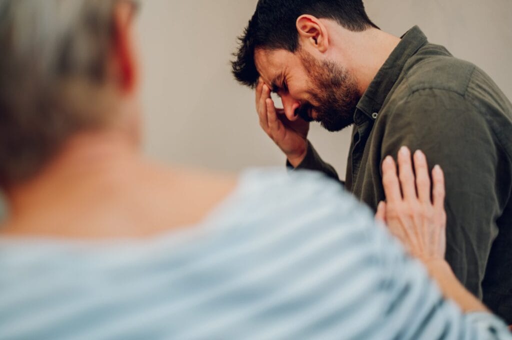 man being vulnerable in therapy