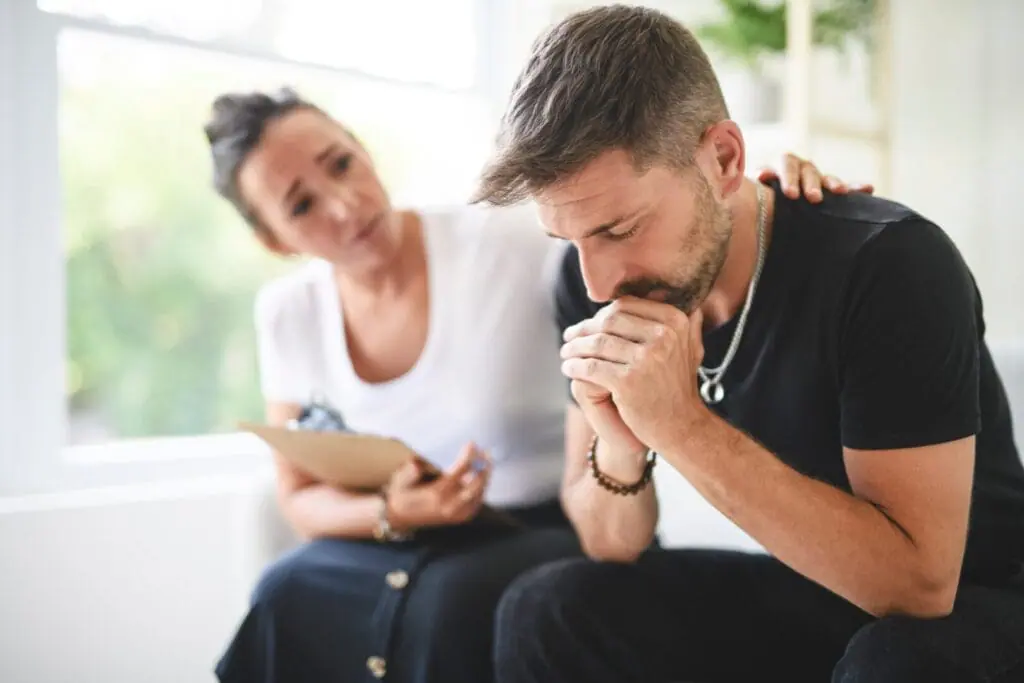 doctor treating meth addict in recovery